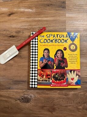 The Spatulatta Cookbook with Red Spatula by Scholastic.